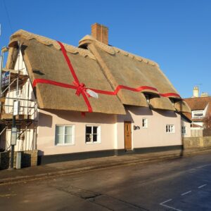 Christmas Bow on Thatched Roof